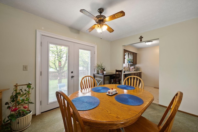 2512 Gantz Rd, Grove City, OH 43123 - dining room featuring light colored carpet, ceiling fan, french doors, and baseboards