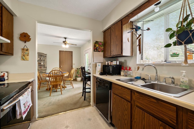 2512 Gantz Rd, Grove City, OH 43123 - kitchen with dishwasher, electric stove, a sink, light carpet, and light countertops
