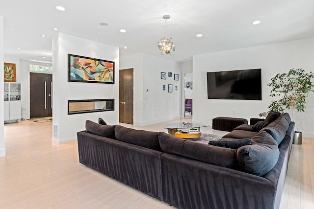 3084 Asbury Dr, Columbus, OH 43221 - living room featuring light wood-style floors, recessed lighting, baseboards, and a chandelier