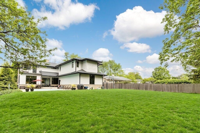 3084 Asbury Dr, Columbus, OH 43221 - back of property with stucco siding and a patio