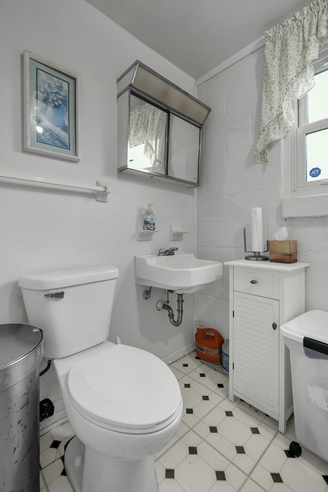 bathroom featuring toilet and a sink