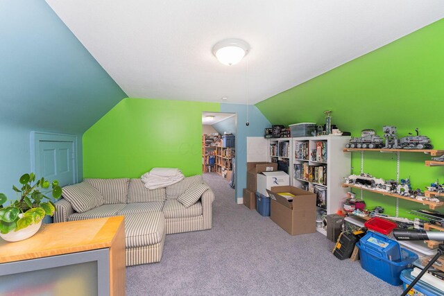living area with carpet floors and vaulted ceiling