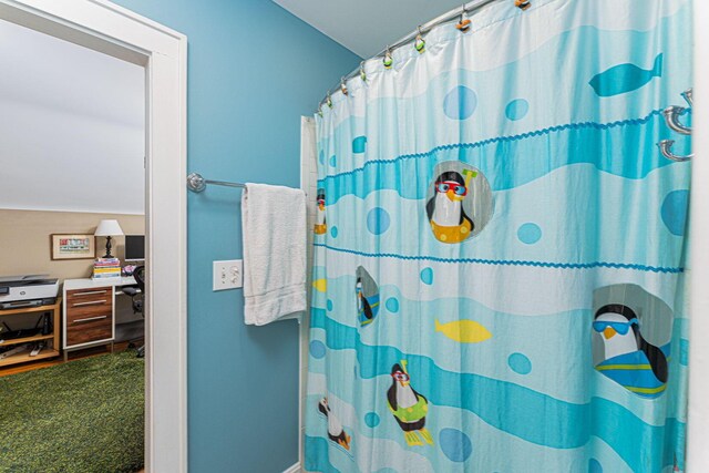 bathroom featuring a shower with curtain