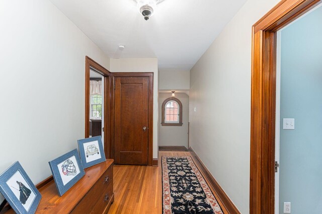 hallway with light wood-type flooring