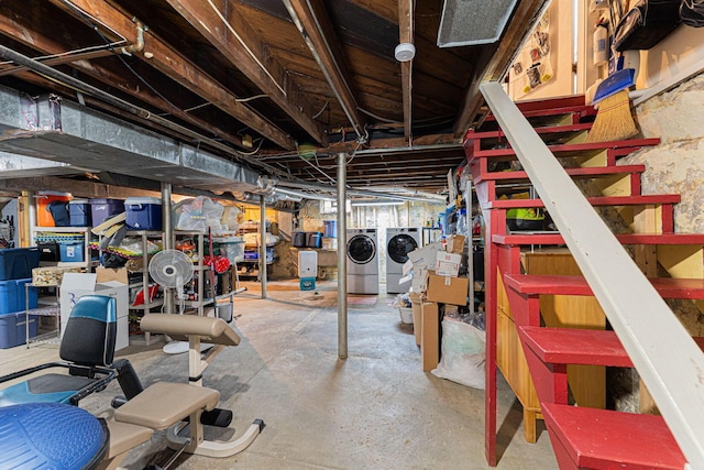 unfinished basement with independent washer and dryer and stairway