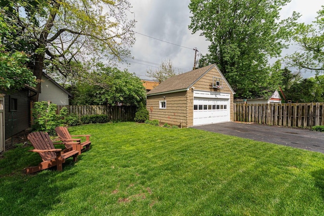 view of yard with an outbuilding and a garage