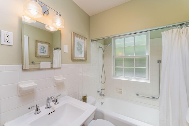 1324 Haines Ave, Columbus, OH 43212 - bathroom with a sink, shower / bathtub combination with curtain, tile walls, and toilet