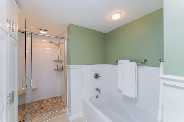 1324 Haines Ave, Columbus, OH 43212 - bathroom featuring a shower stall and a garden tub