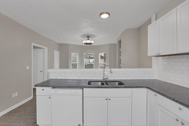 1617 Arlington Ave, Columbus, OH 43211 - kitchen with white dishwasher, a sink, tasteful backsplash, a textured ceiling, and white cabinets