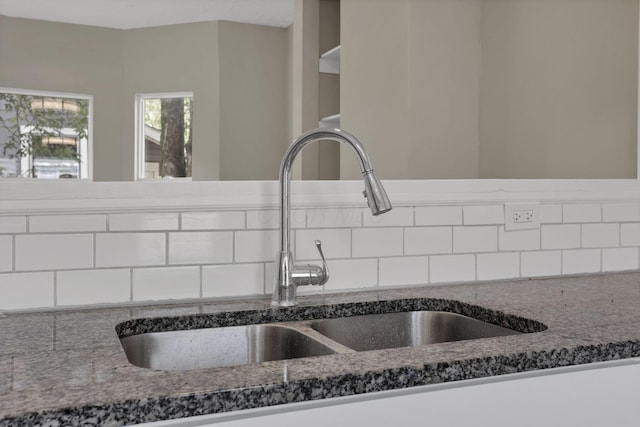 1617 Arlington Ave, Columbus, OH 43211 - kitchen view of a sink, decorative backsplash, and dark stone countertops