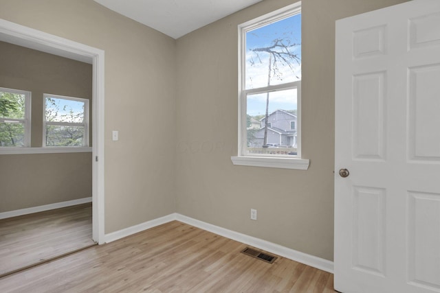1617 Arlington Ave, Columbus, OH 43211 - spare room featuring light wood-type flooring, healthy amount of natural light, and baseboards