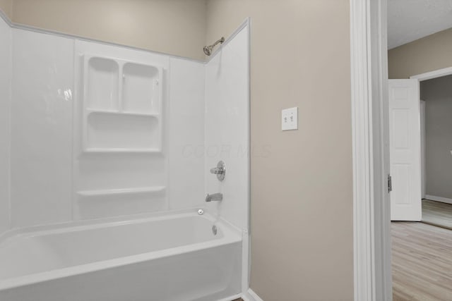 1617 Arlington Ave, Columbus, OH 43211 - full bath with shower / bathtub combination, baseboards, and wood finished floors