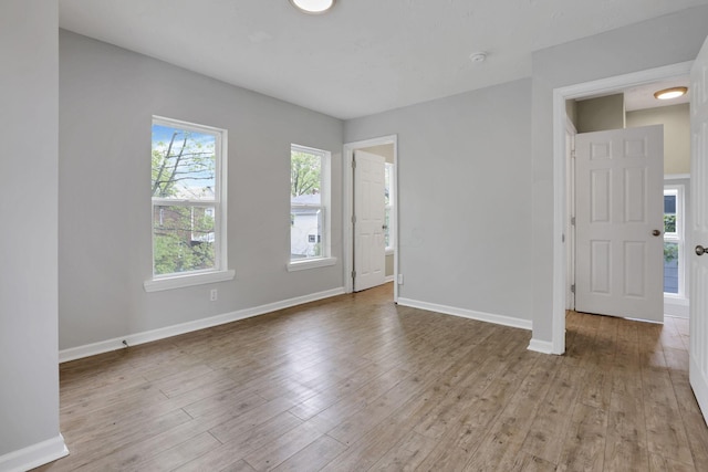 1617 Arlington Ave, Columbus, OH 43211 - spare room with wood finished floors, baseboards, and a smoke detector