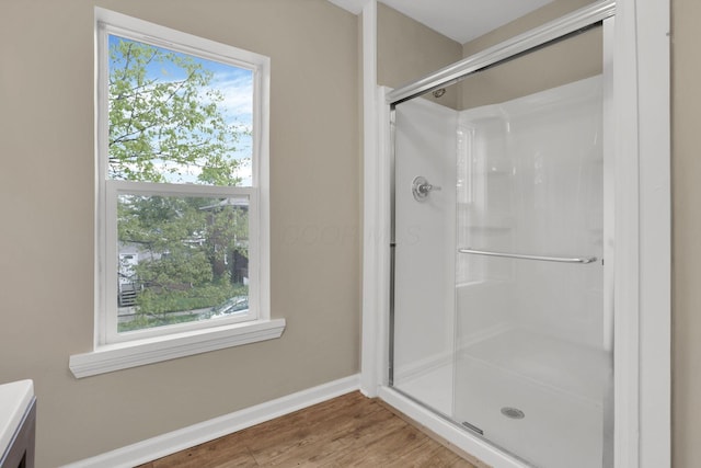 1617 Arlington Ave, Columbus, OH 43211 - full bath with a stall shower, healthy amount of natural light, baseboards, and wood finished floors
