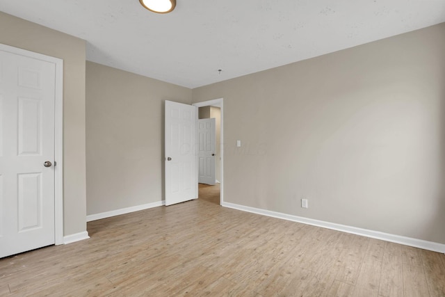 1617 Arlington Ave, Columbus, OH 43211 - unfurnished bedroom featuring light wood-style floors and baseboards