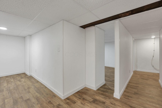 1617 Arlington Ave, Columbus, OH 43211 - finished basement featuring wood finished floors, a drop ceiling, and baseboards