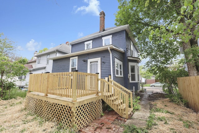 1617 Arlington Ave, Columbus, OH 43211 - back of property with a chimney, a deck, and fence