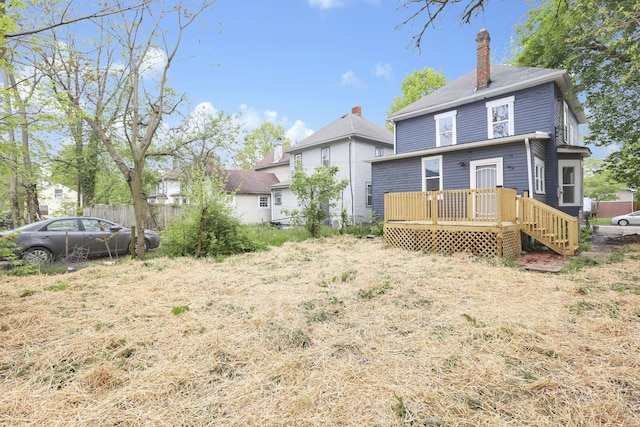 1617 Arlington Ave, Columbus, OH 43211 - rear view of property with a wooden deck, a chimney, and fence