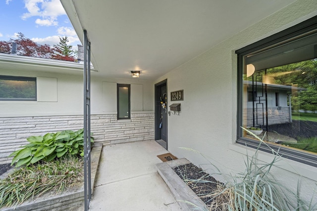 2249 E Broad St, Columbus, OH 43209 - view of exterior entry featuring stucco siding and stone siding