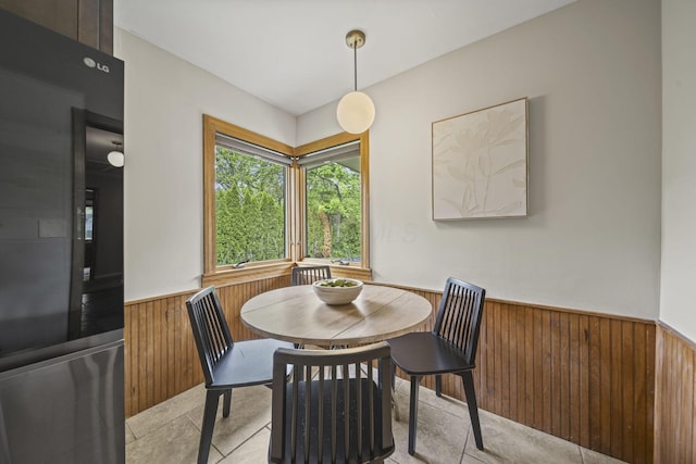 2249 E Broad St, Columbus, OH 43209 - dining room with wainscoting, wooden walls, and light tile patterned floors