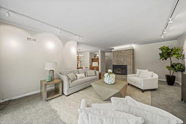 2249 E Broad St, Columbus, OH 43209 - living room with rail lighting, carpet, baseboards, crown molding, and a fireplace