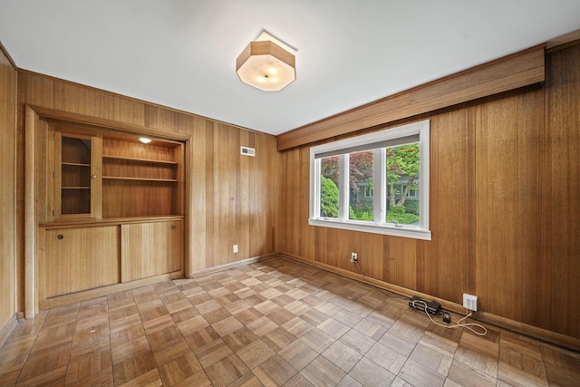 2249 E Broad St, Columbus, OH 43209 - unfurnished room with wooden walls and baseboards