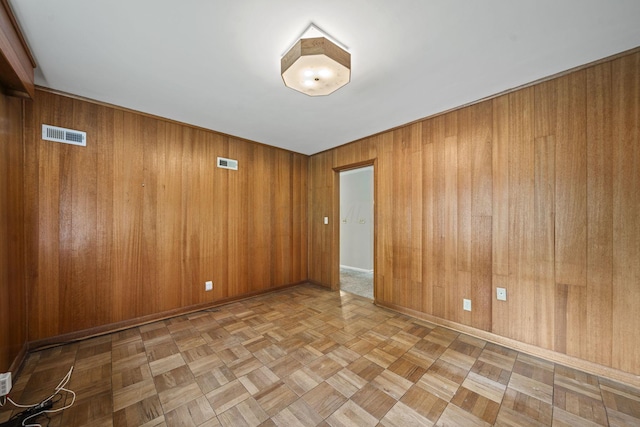 2249 E Broad St, Columbus, OH 43209 - empty room featuring wood walls and baseboards