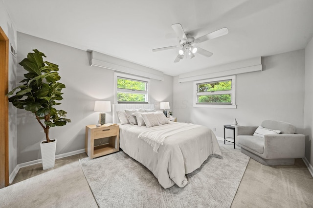 2249 E Broad St, Columbus, OH 43209 - bedroom with light carpet, baseboards, and a ceiling fan