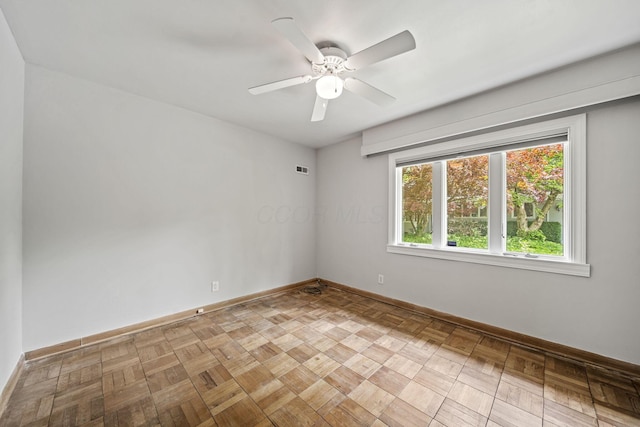 2249 E Broad St, Columbus, OH 43209 - spare room with baseboards and a ceiling fan