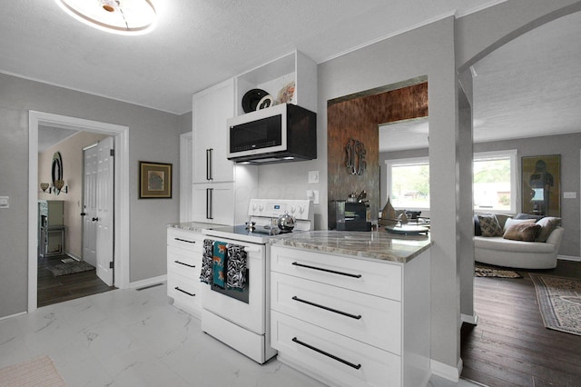 3130 Marwick Rd, Columbus, OH 43232 - kitchen featuring white appliances, light stone countertops, white cabinets, a textured ceiling, and light marble finish floors