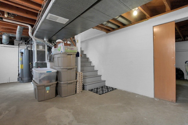 3130 Marwick Rd, Columbus, OH 43232 - unfinished below grade area with water heater, concrete block wall, and stairs