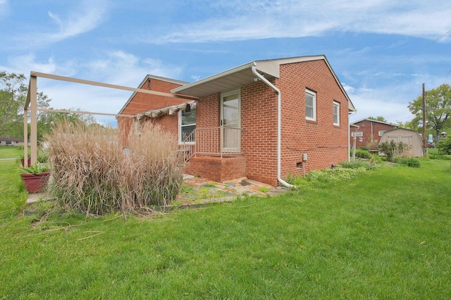 3130 Marwick Rd, Columbus, OH 43232 - view of side of property featuring brick siding and a lawn
