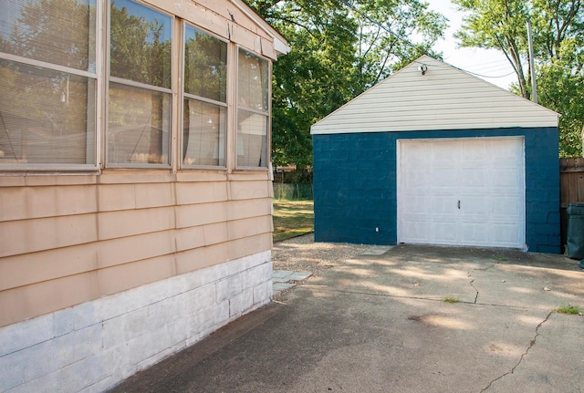 detached garage featuring driveway