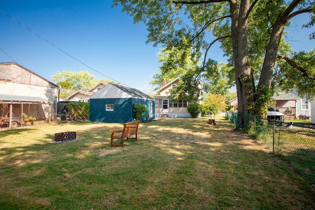 view of yard with a fire pit