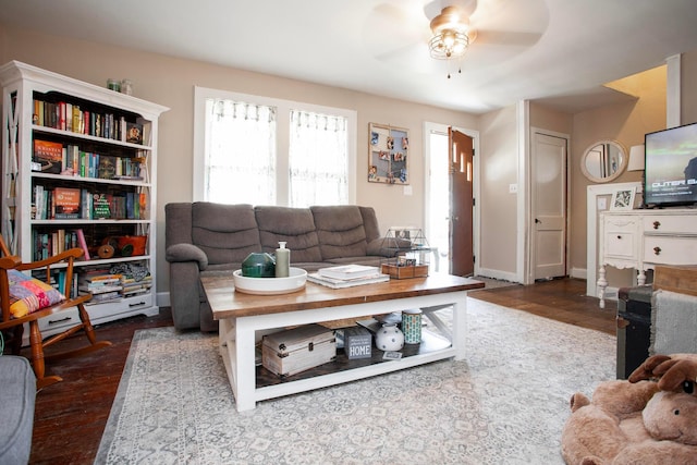 living area featuring wood finished floors and a ceiling fan