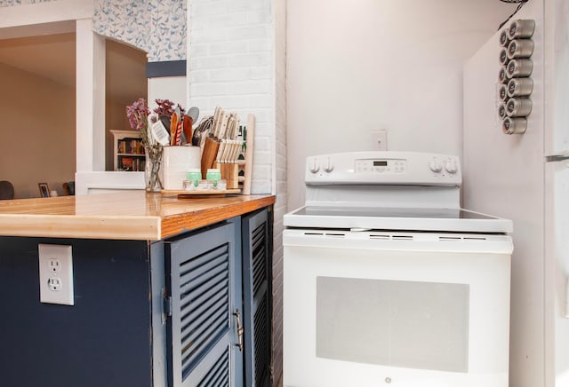 kitchen featuring electric stove, butcher block counters, and beverage cooler