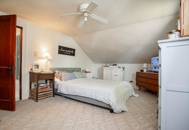 bedroom with carpet floors, lofted ceiling, and ceiling fan