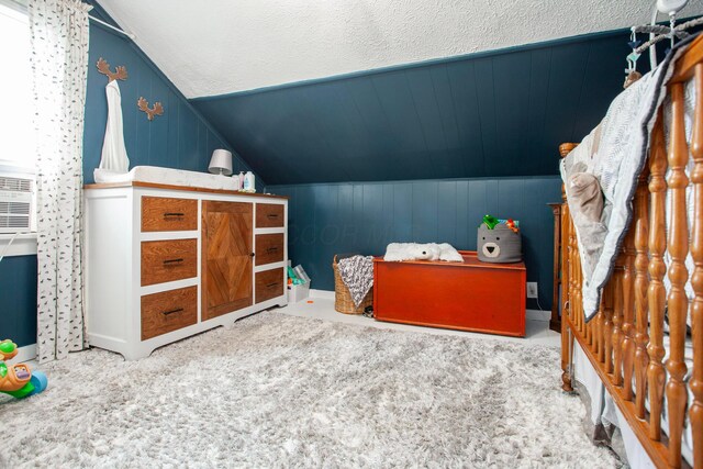 carpeted bedroom featuring vaulted ceiling