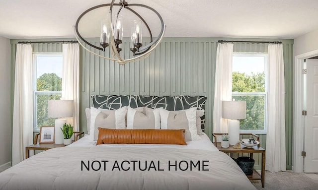 104 Red Willow Dr, Etna, OH 43068 - carpeted bedroom featuring a chandelier and multiple windows