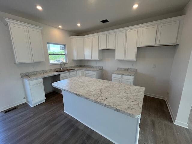 104 Red Willow Dr, Etna, OH 43068 - kitchen featuring a sink, a kitchen island, dark wood-style floors, white cabinets, and baseboards
