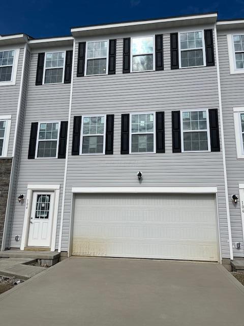 104 Red Willow Dr, Etna, OH 43068 - townhome / multi-family property featuring an attached garage and concrete driveway