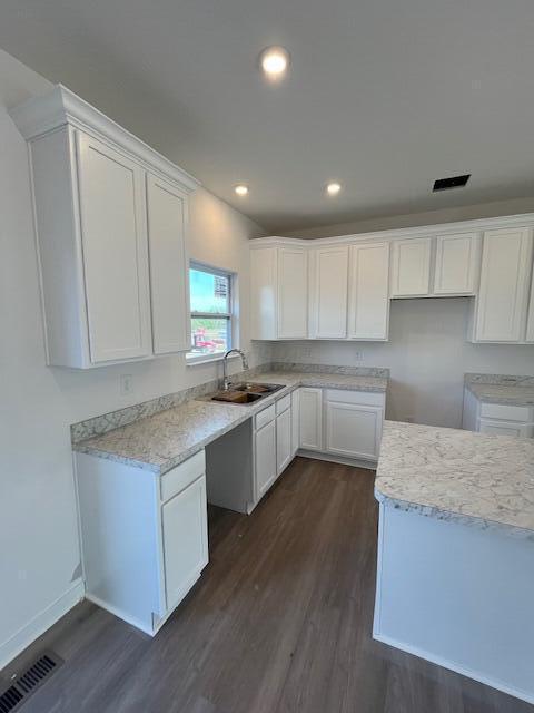 104 Red Willow Dr, Etna, OH 43068 - kitchen with dark wood-style flooring, a sink, white cabinetry, and recessed lighting