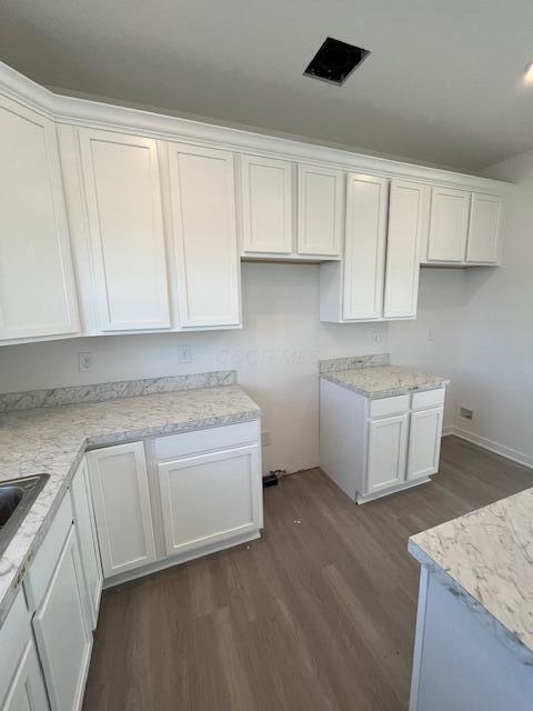 104 Red Willow Dr, Etna, OH 43068 - kitchen featuring dark wood-style floors, white cabinets, and baseboards
