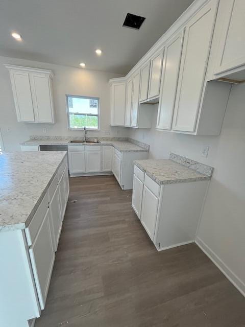 104 Red Willow Dr, Etna, OH 43068 - kitchen featuring a sink, wood finished floors, white cabinetry, recessed lighting, and baseboards