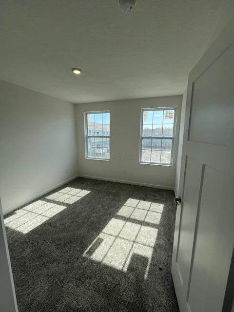 104 Red Willow Dr, Etna, OH 43068 - carpeted empty room featuring healthy amount of natural light, baseboards, and recessed lighting