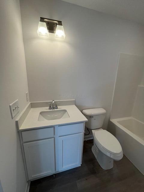 104 Red Willow Dr, Etna, OH 43068 - bathroom with toilet, vanity, and wood finished floors