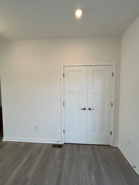104 Red Willow Dr, Etna, OH 43068 - unfurnished bedroom featuring dark wood finished floors, baseboards, a closet, and recessed lighting