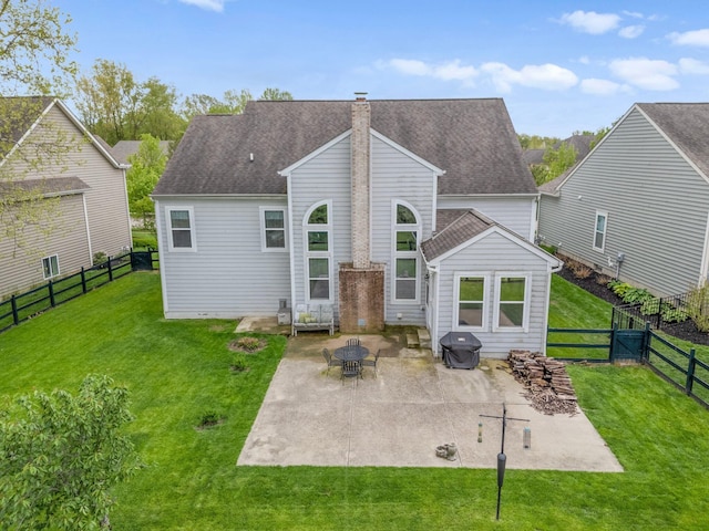 6674 Letterman Dr, Powell, OH 43065 - back of house featuring a chimney, a patio area, and a shingled roof