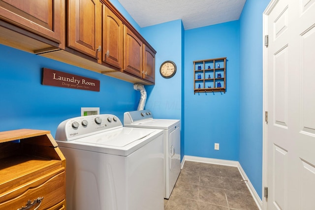6674 Letterman Dr, Powell, OH 43065 - laundry area with separate washer and dryer, baseboards, light tile patterned floors, cabinet space, and a textured ceiling