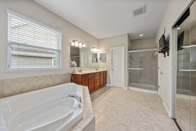 6674 Letterman Dr, Powell, OH 43065 - full bathroom with a bath, a stall shower, double vanity, and tile patterned floors